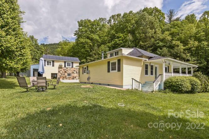 1411 Bailey Branch Road Burnsville, NC 28714 - Photo 24 of 40 a house that has sitting area in backyard