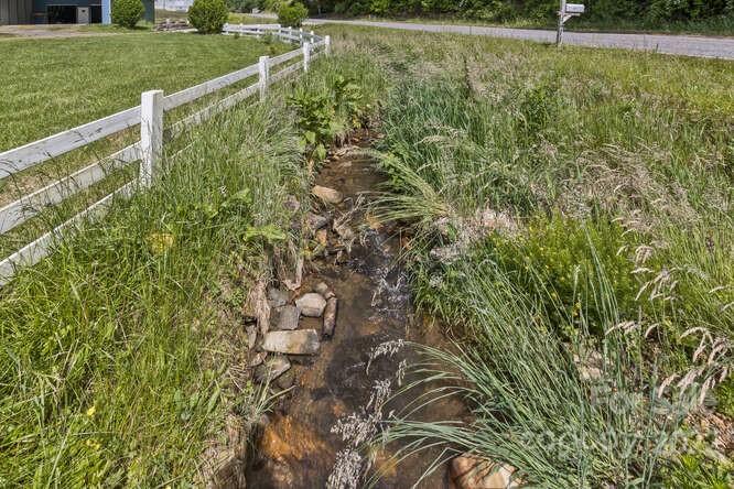 1411 Bailey Branch Road Burnsville, NC 28714 - Photo 6 of 40 a view of a yard with a house