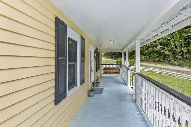 1411 Bailey Branch Road Burnsville, NC 28714 - Photo 7 of 40 a view of a porch and wooden floor