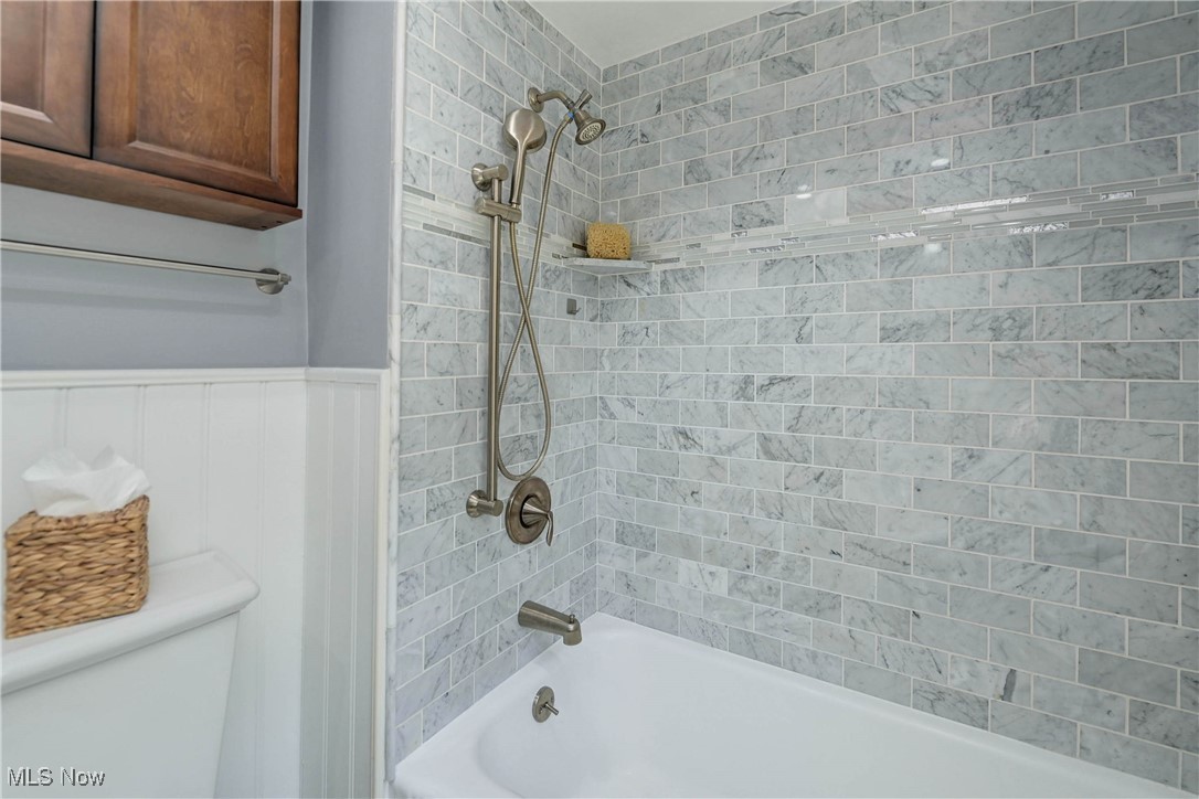 4022 Hillbrook Road Cleveland, OH 44118 - Photo 24 of 49 Bathroom with shower / bathtub combination and wainscoting