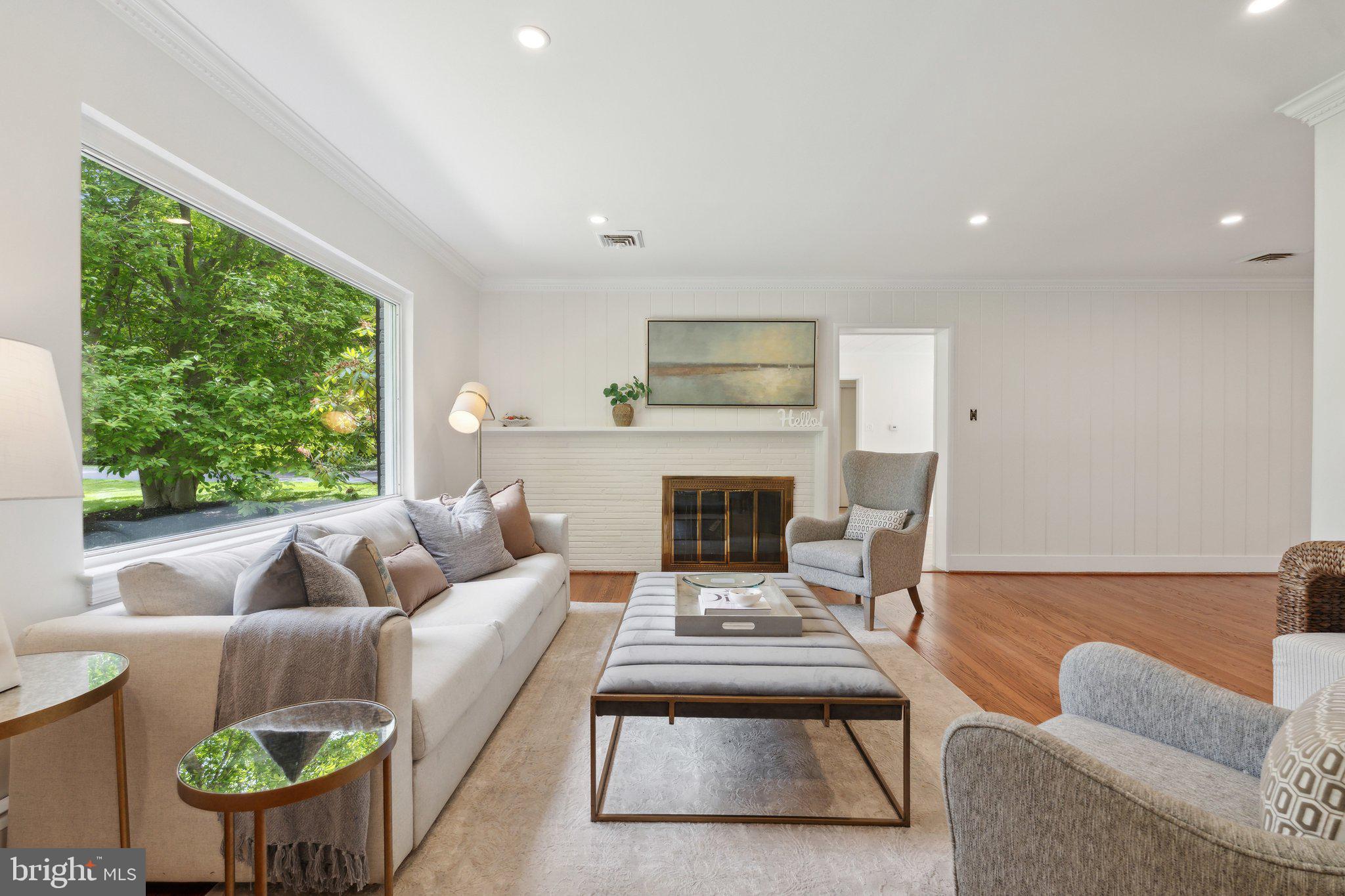 701 Notley Road Silver Spring, MD 20904 - Photo 1 of 60 a living room with furniture fireplace and a large window