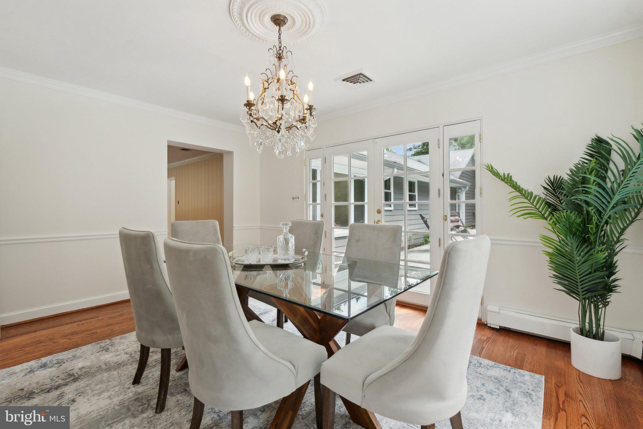 701 Notley Road Silver Spring, MD 20904 - Photo 17 of 60 a view of a dining room with furniture window and wooden floor