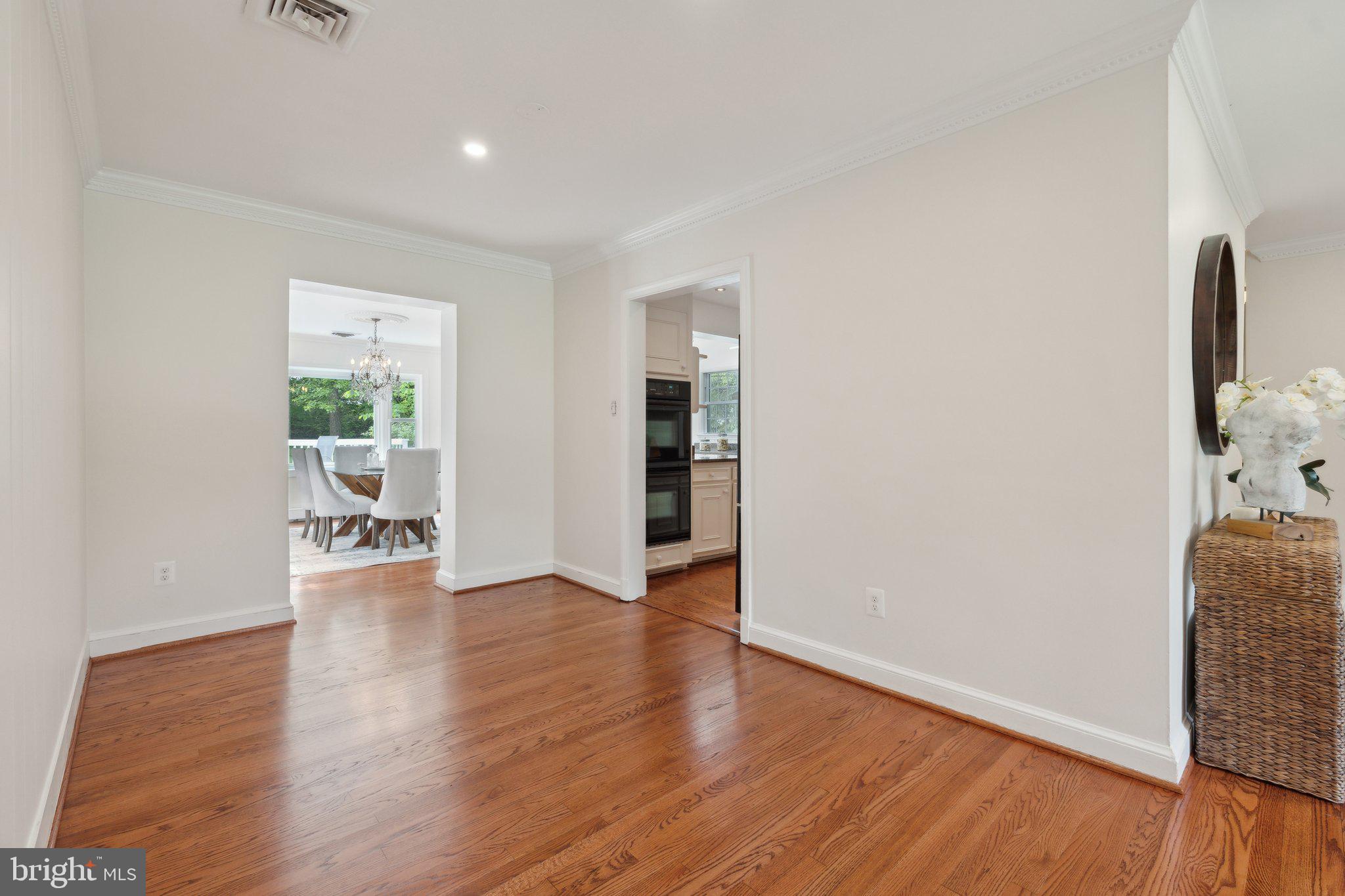 701 Notley Road Silver Spring, MD 20904 - Photo 18 of 60 an empty room with wooden floor and windows