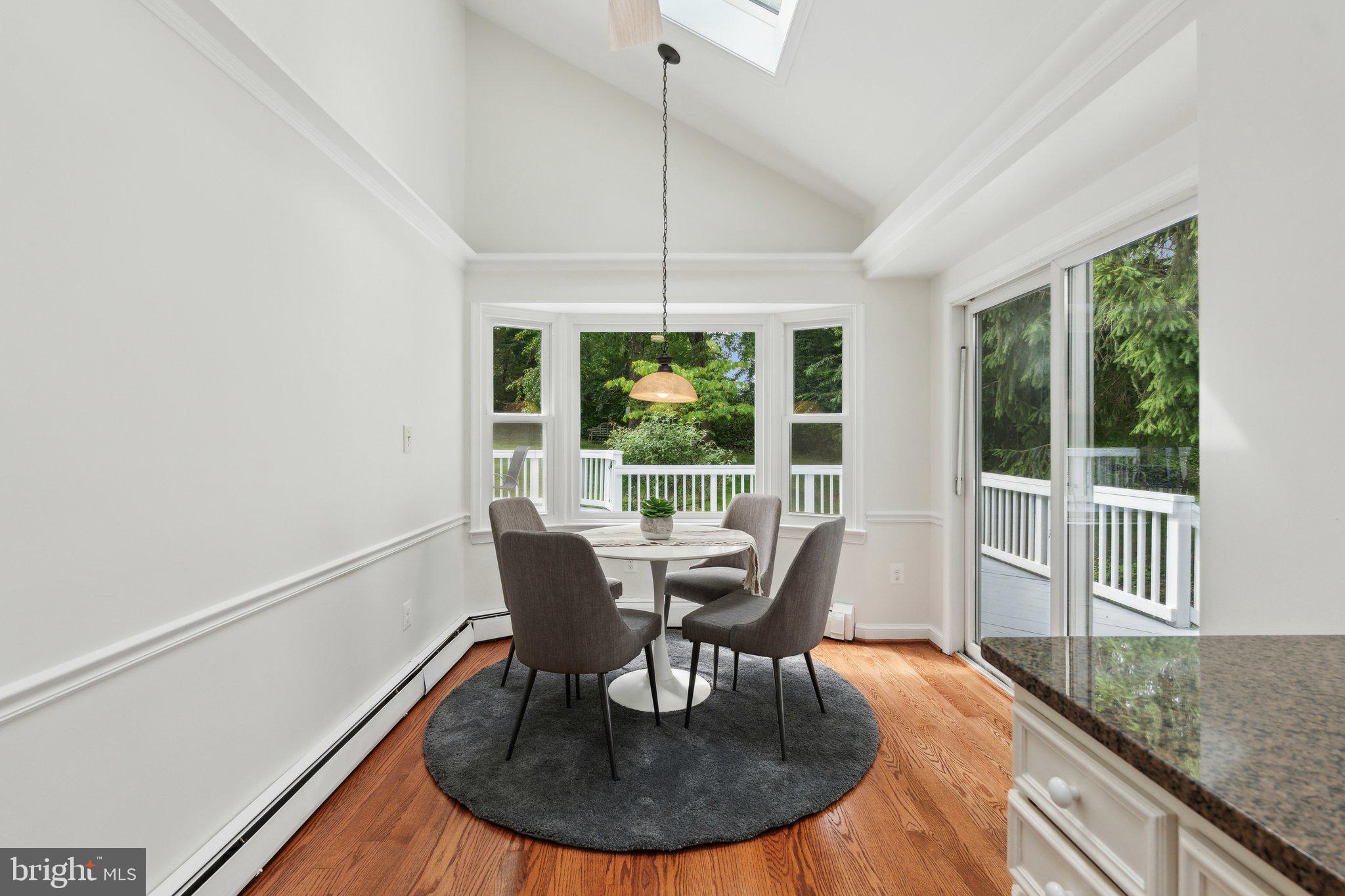 701 Notley Road Silver Spring, MD 20904 - Photo 21 of 60 a dining room with furniture a chandelier and wooden floor