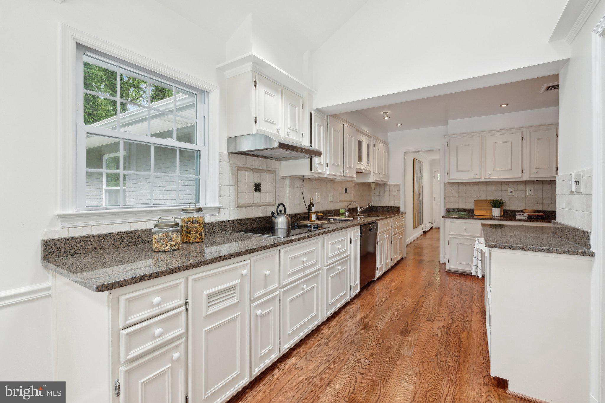 701 Notley Road Silver Spring, MD 20904 - Photo 3 of 60 a kitchen with granite countertop white cabinets and white appliances