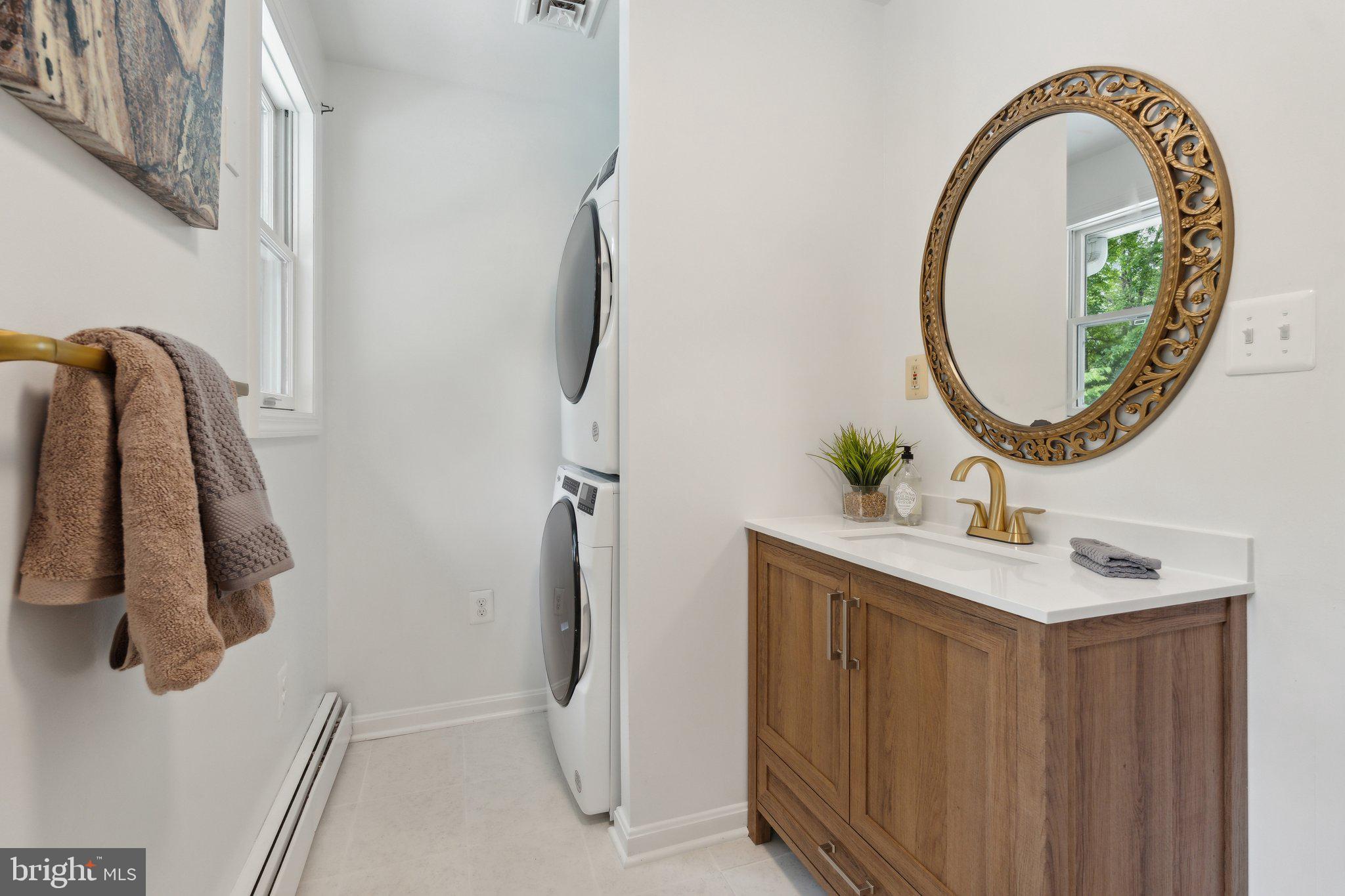 701 Notley Road Silver Spring, MD 20904 - Photo 31 of 60 a bathroom with a sink and mirror
