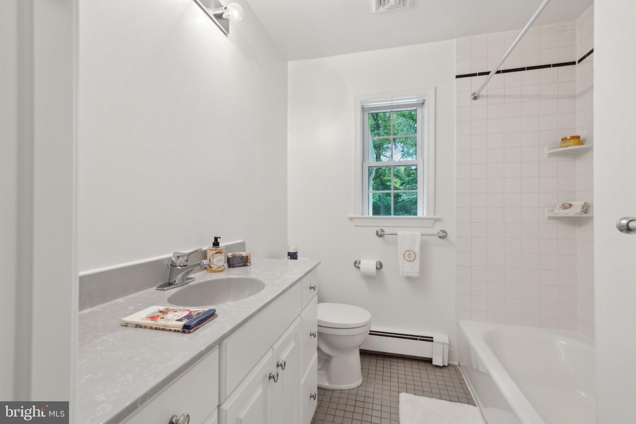 701 Notley Road Silver Spring, MD 20904 - Photo 35 of 60 a bathroom with a sink toilet and shower