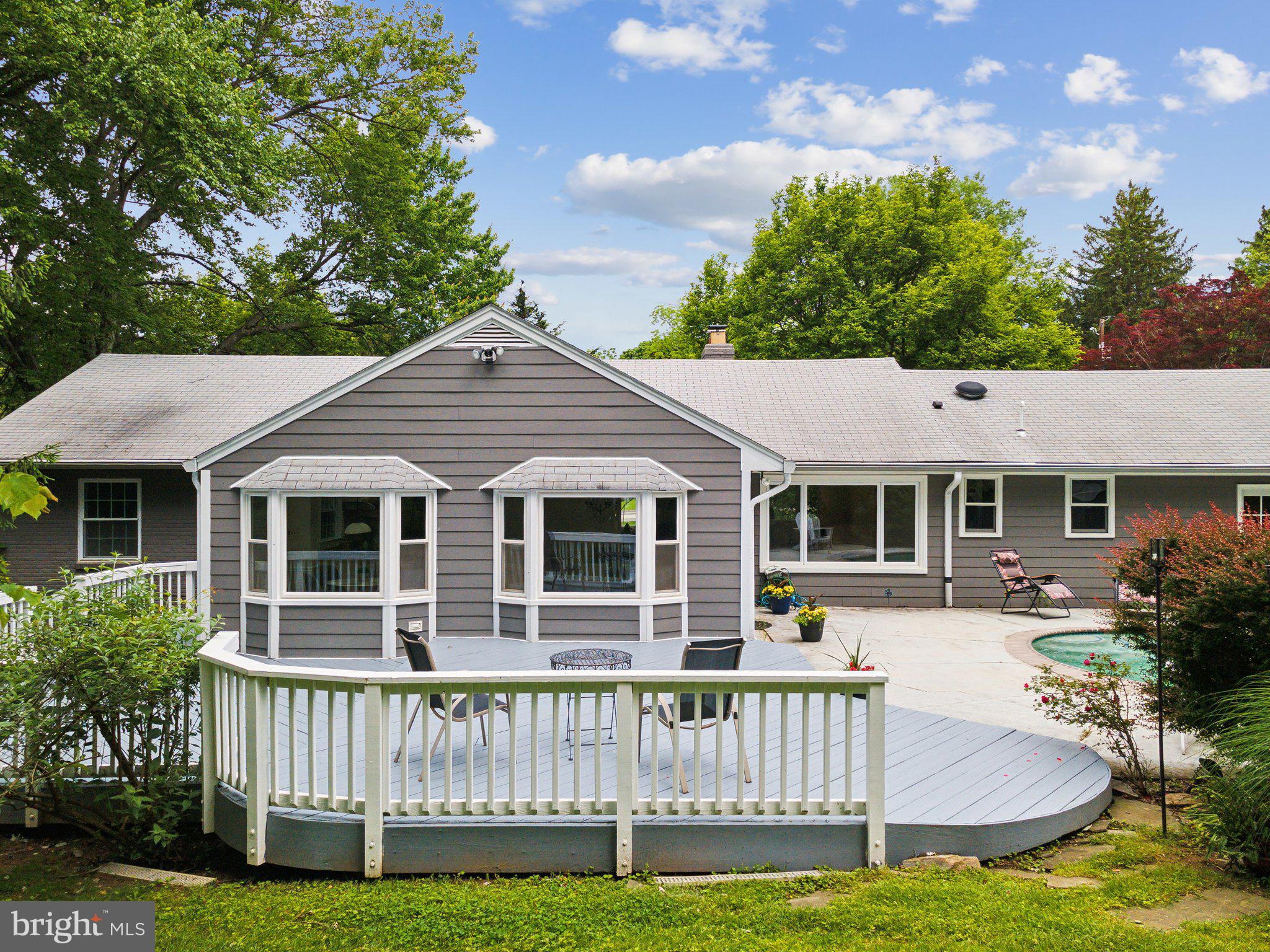 701 Notley Road Silver Spring, MD 20904 - Photo 36 of 60 a front view of a house with a yard table and chairs