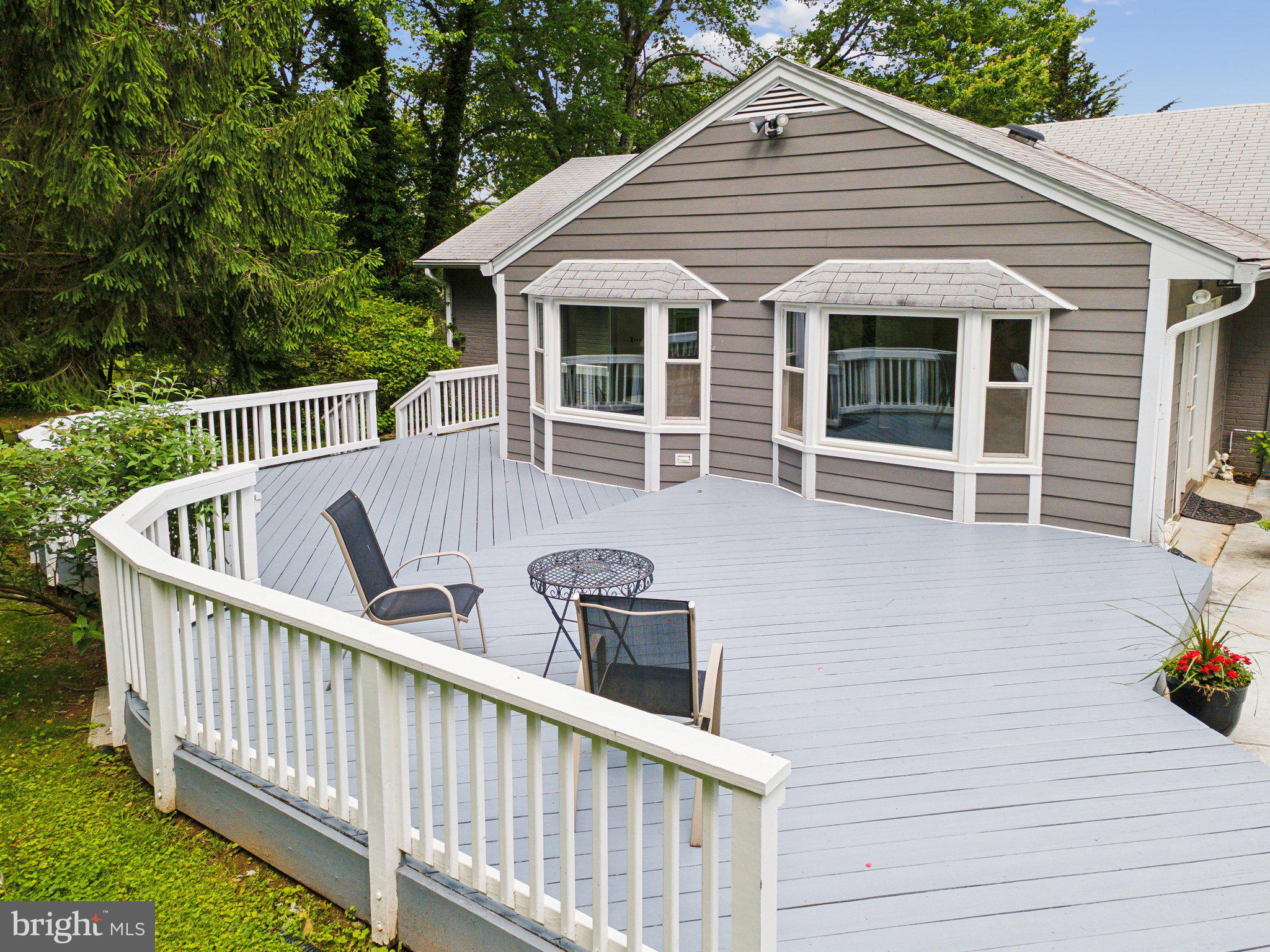 701 Notley Road Silver Spring, MD 20904 - Photo 37 of 60 a view of a deck with a chair and wooden floor