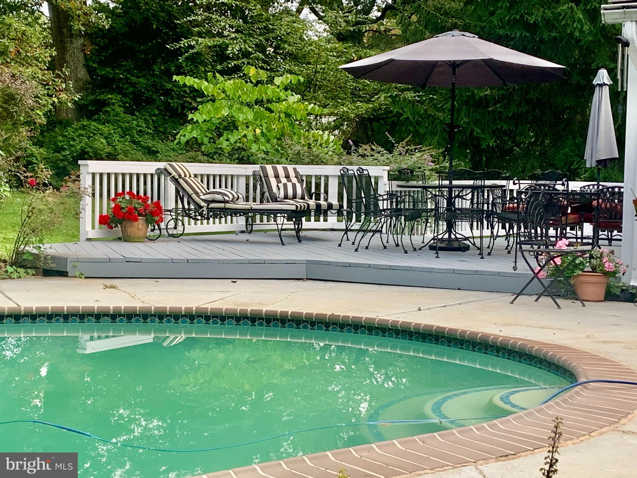701 Notley Road Silver Spring, MD 20904 - Photo 40 of 60 a view of a swimming pool with a patio and a yard