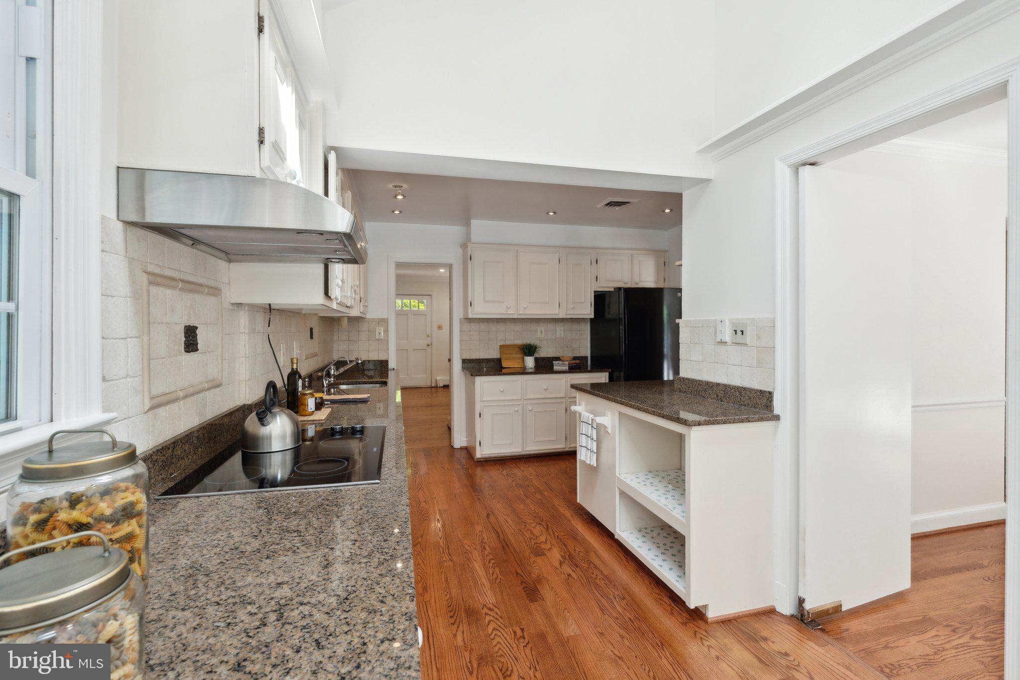701 Notley Road Silver Spring, MD 20904 - Photo 4 of 60 a kitchen with stainless steel appliances granite countertop a sink stove and refrigerator