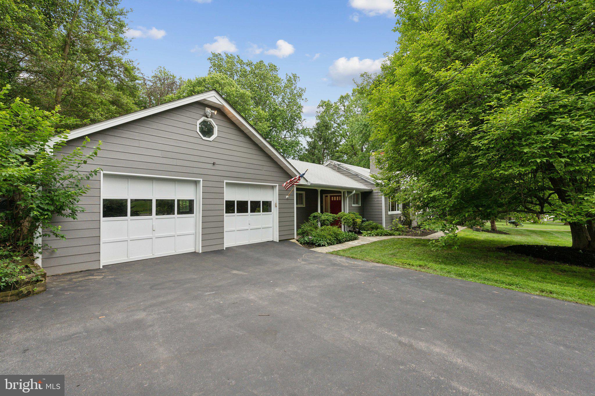 701 Notley Road Silver Spring, MD 20904 - Photo 57 of 60 a front view of a house with a yard and garage
