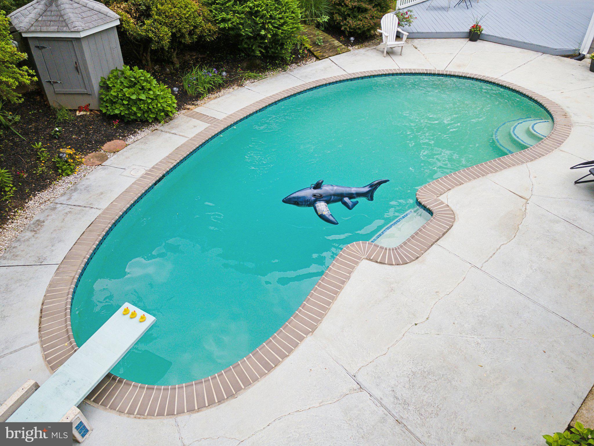 701 Notley Road Silver Spring, MD 20904 - Photo 7 of 60 a view of a swimming pool with a patio