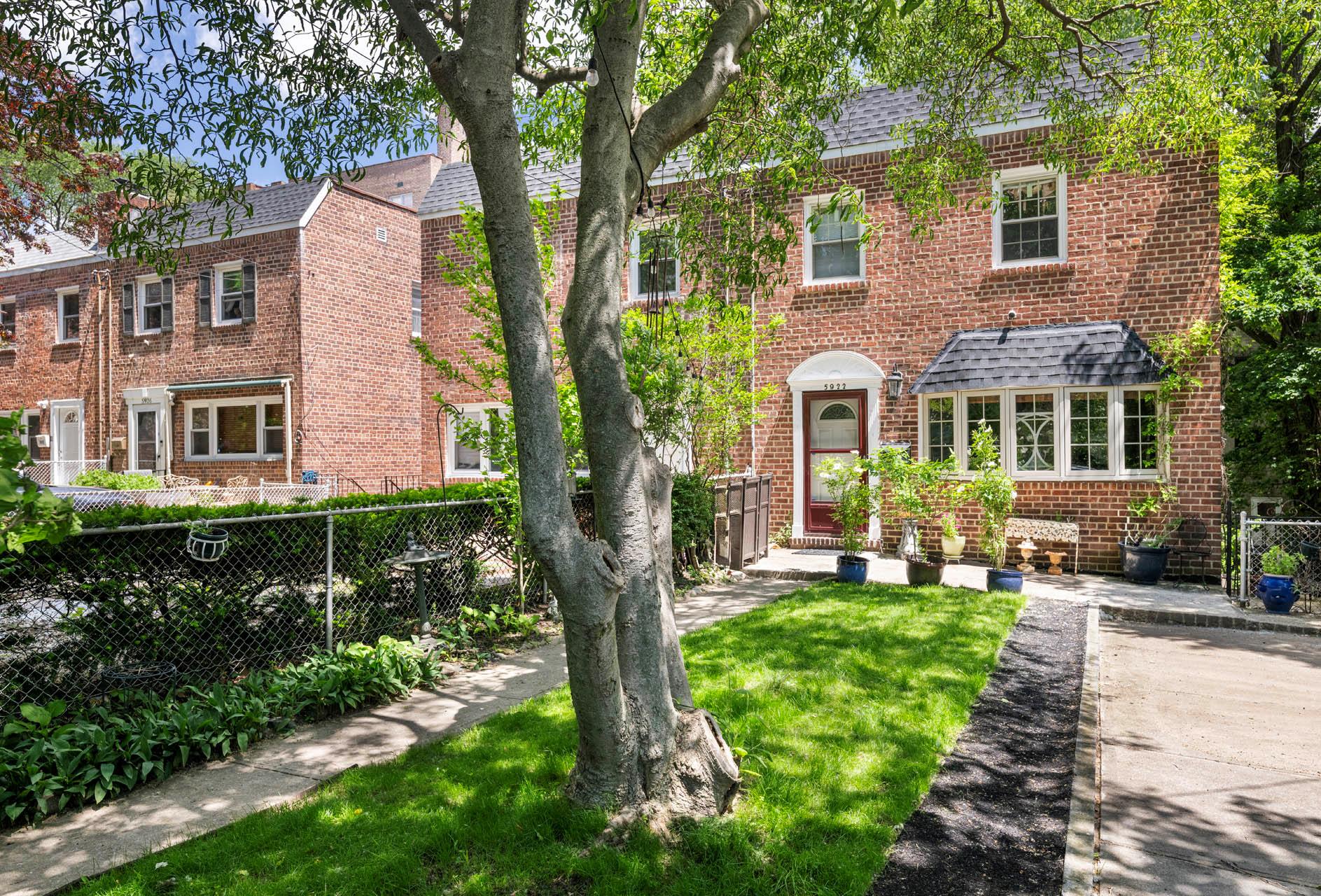 View of front of home with brick siding and a shingled roof
