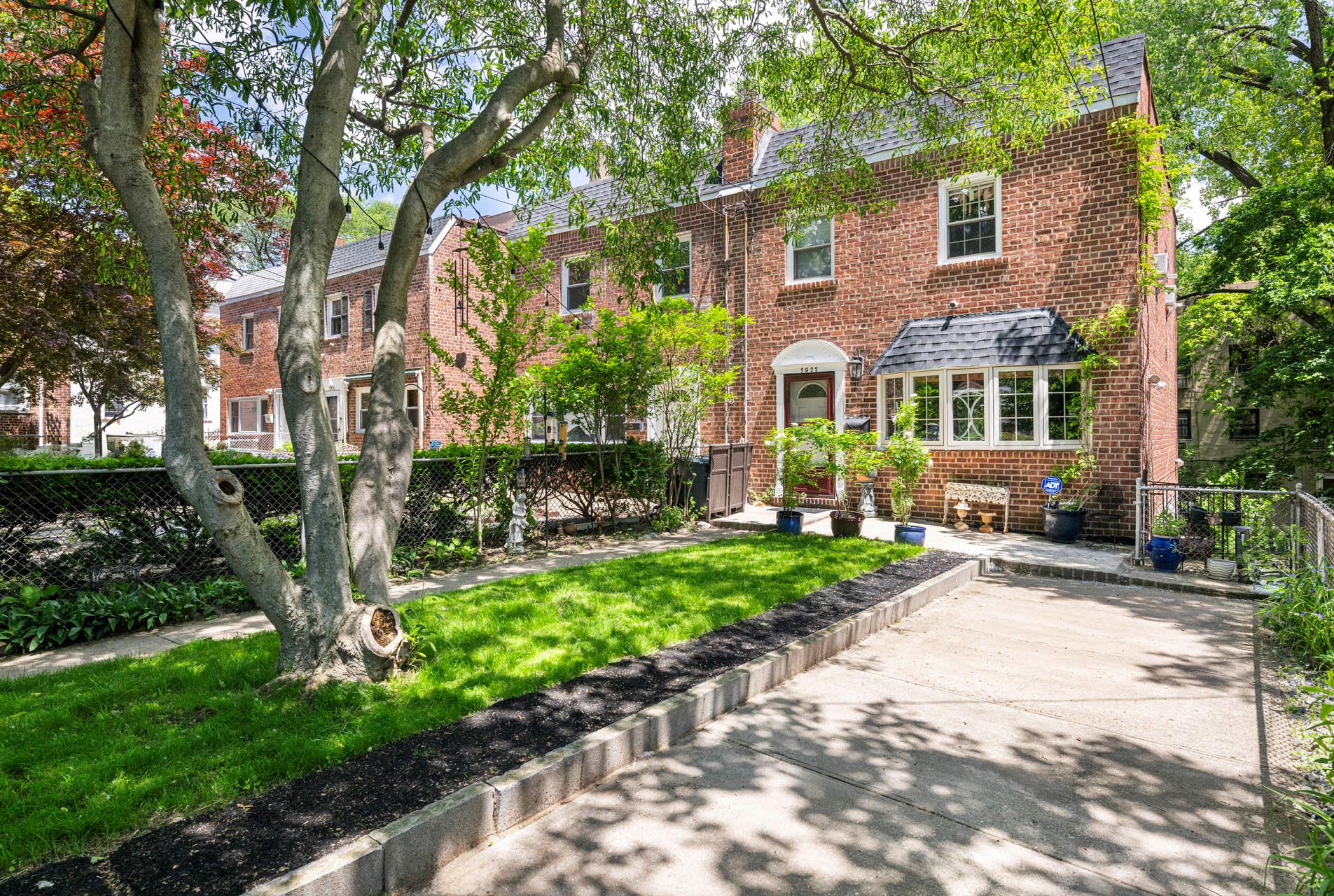 5922 Post Road Bronx, NY 10471 - Photo 2 of 13 View of front facade with brick siding and a chimney