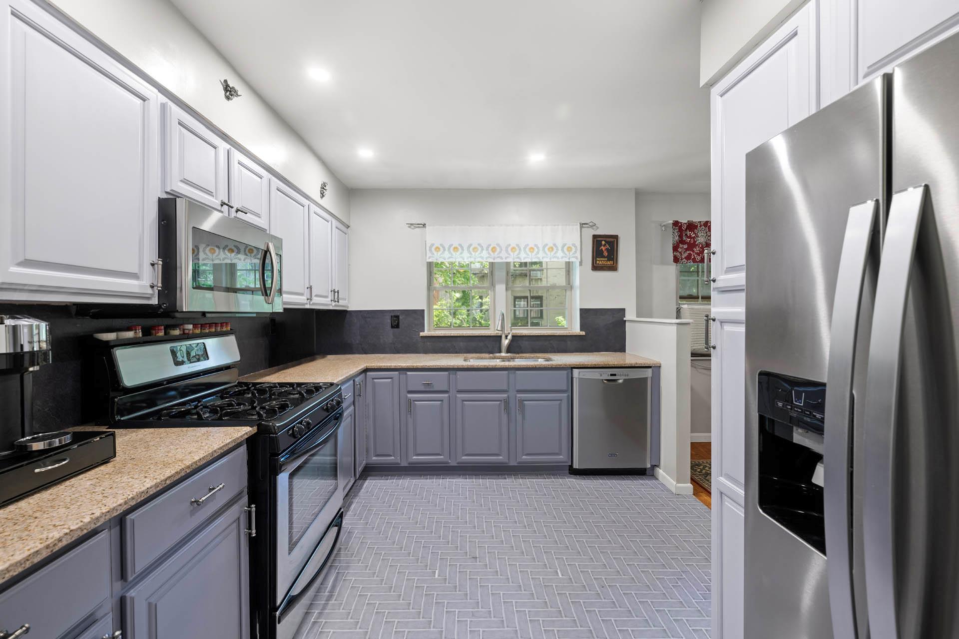 5922 Post Road Bronx, NY 10471 - Photo 3 of 13 Kitchen featuring appliances with stainless steel finishes, a sink, white cabinetry, recessed lighting, and gray cabinets