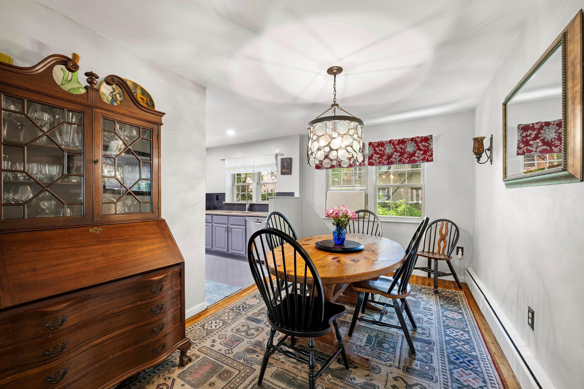5922 Post Road Bronx, NY 10471 - Photo 5 of 13 Dining room featuring wood finished floors, a baseboard radiator, and healthy amount of natural light