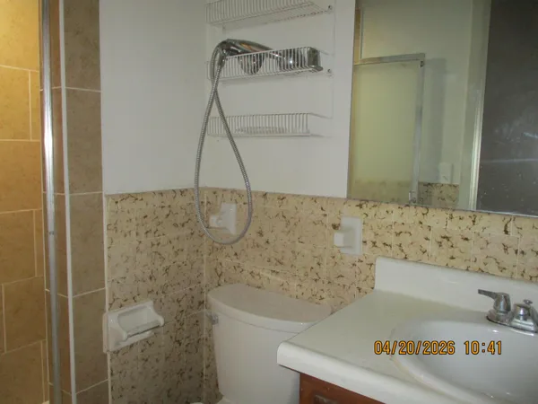 a bathroom with a bathtub and shower