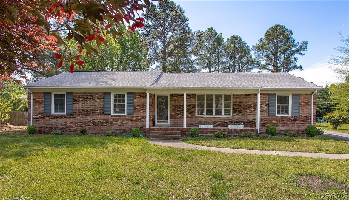 4061 Falstone Road North Chesterfield, VA 23234 - Photo 1 of 33 a front view of a house with a garden and yard