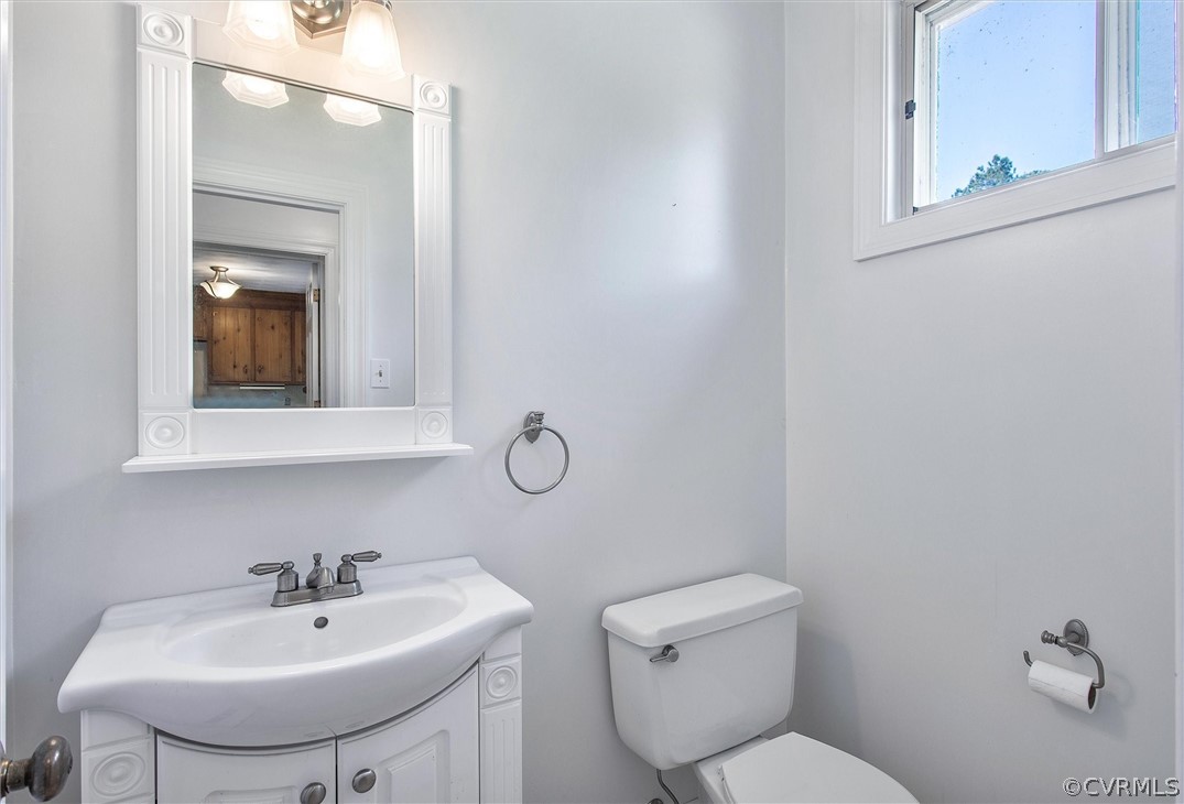 4061 Falstone Road North Chesterfield, VA 23234 - Photo 15 of 33 a bathroom with a toilet sink and mirror