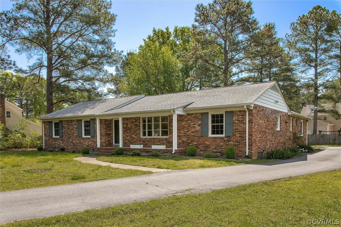 4061 Falstone Road North Chesterfield, VA 23234 - Photo 2 of 33 a front view of a house with a garden