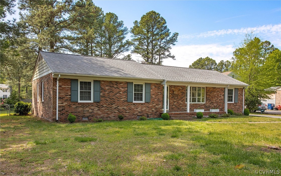 4061 Falstone Road North Chesterfield, VA 23234 - Photo 3 of 33 a front view of a house with a garden
