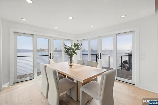 a view of a dining room with furniture and a window