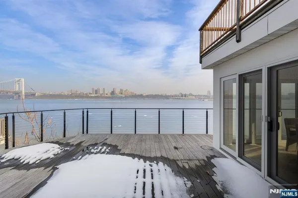 a balcony with furniture and city view