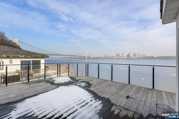 a view of a terrace with wooden floor and city view