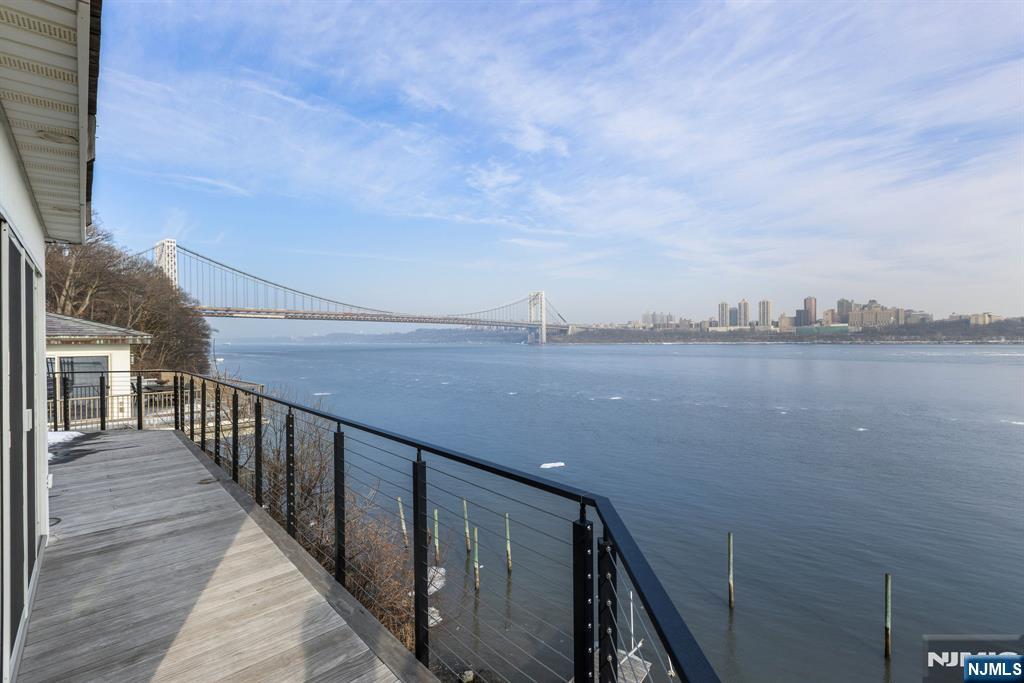 27 Shore Road Edgewater, NJ 07020 - Photo 19 of 48 a view of a balcony with an ocean view