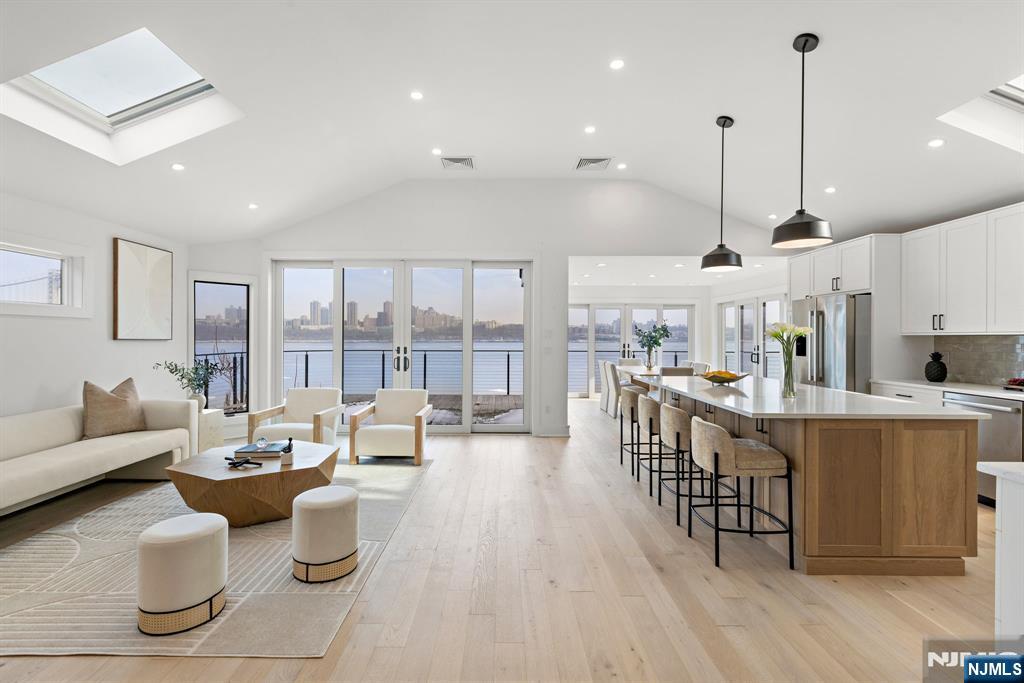 27 Shore Road Edgewater, NJ 07020 - Photo 2 of 48 a very nice looking living room with a large dining table and a large window