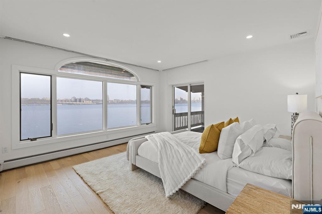 27 Shore Road Edgewater, NJ 07020 - Photo 26 of 48 a living room with furniture and a large window