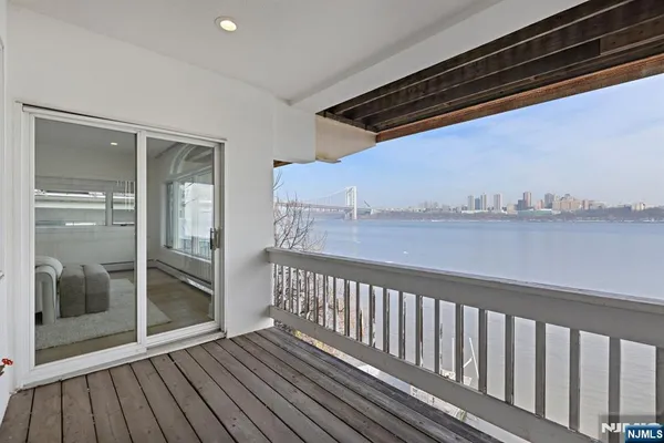a view of balcony with wooden floor