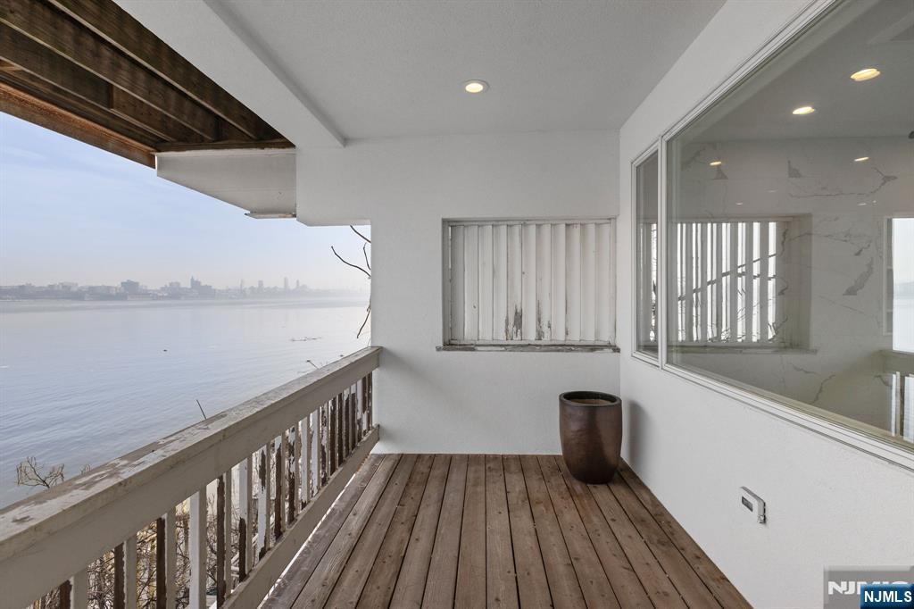 27 Shore Road Edgewater, NJ 07020 - Photo 29 of 48 a view of a kitchen with wooden floor and staircase