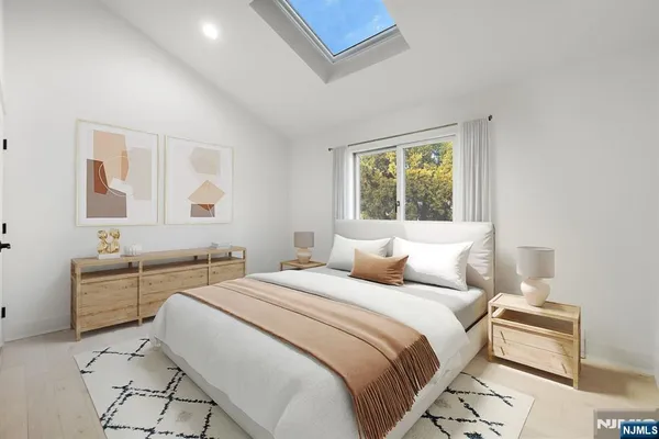 a bedroom with a bed and a table