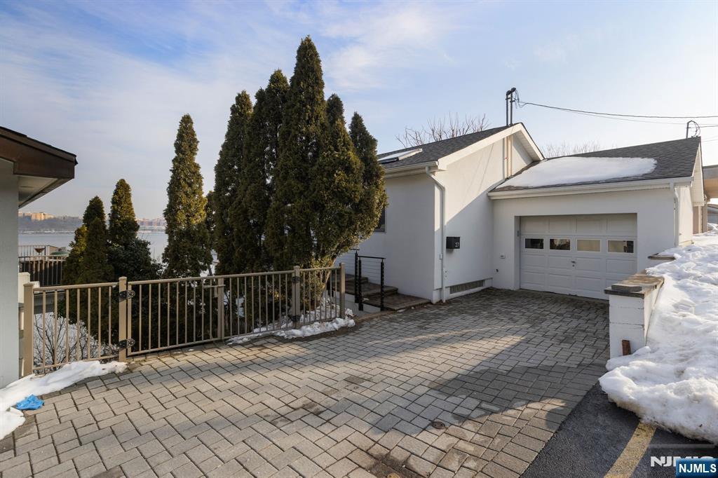 27 Shore Road Edgewater, NJ 07020 - Photo 38 of 48 a view of a house with a yard