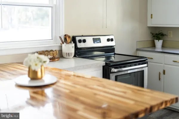 a kitchen with a stove and a sink