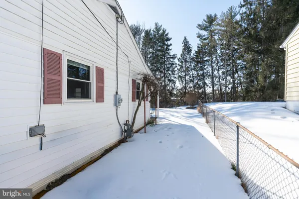 a view of a house with a backyard