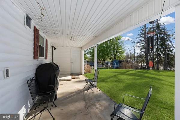 a view of a patio in backyard