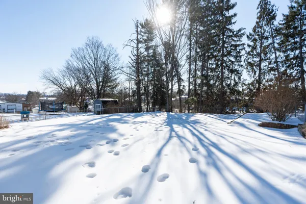a view of snow on the side of road