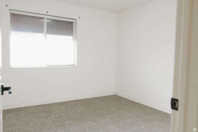 215 South 1050th West, Unit 10 Provo, UT 84601 - Photo 13 of 38 Unfurnished room featuring carpet and baseboards