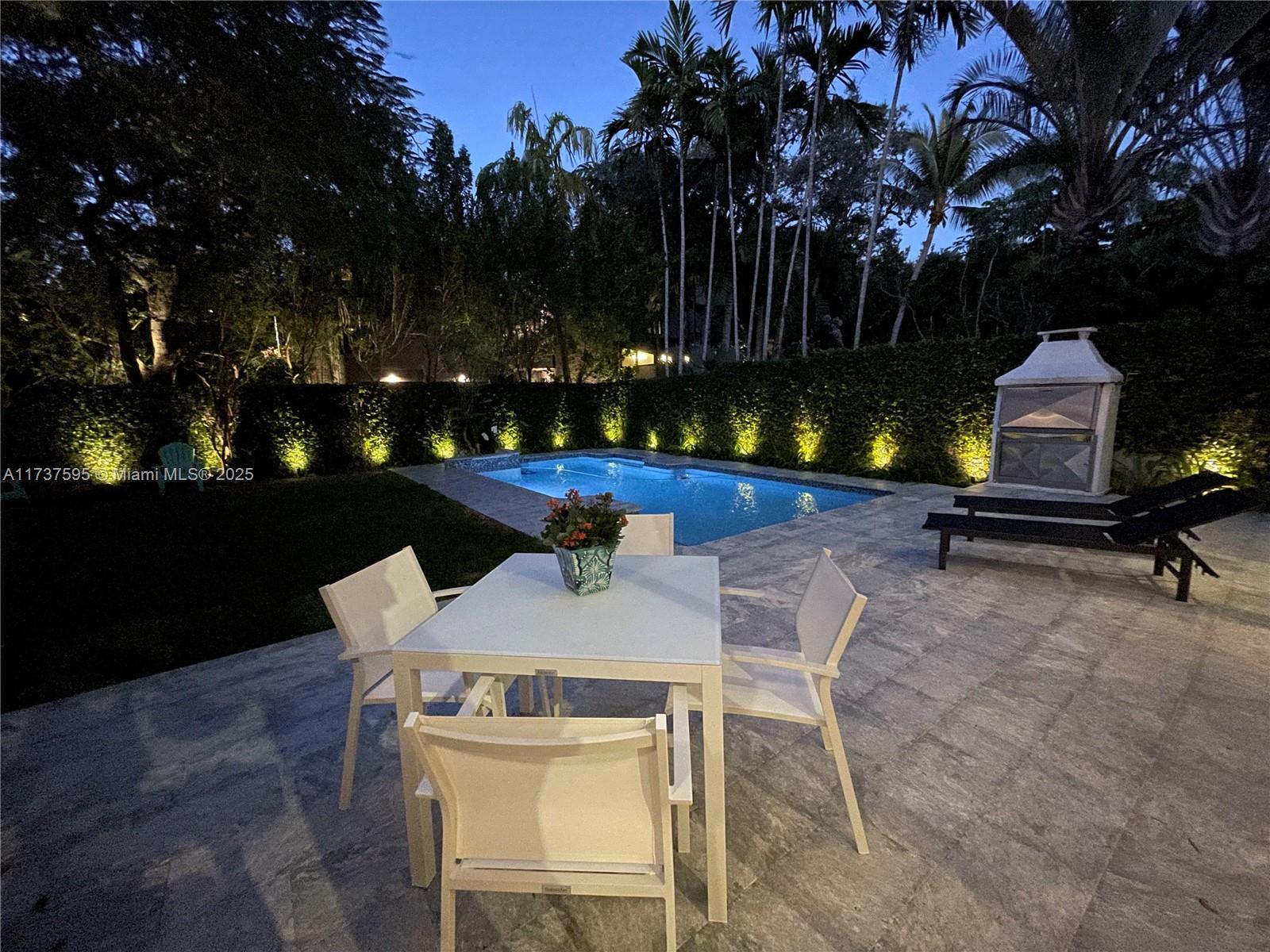 3701 Solana Road Miami, FL 33133 - Photo 12 of 38 a house view with a sitting space fire pit and outdoor space