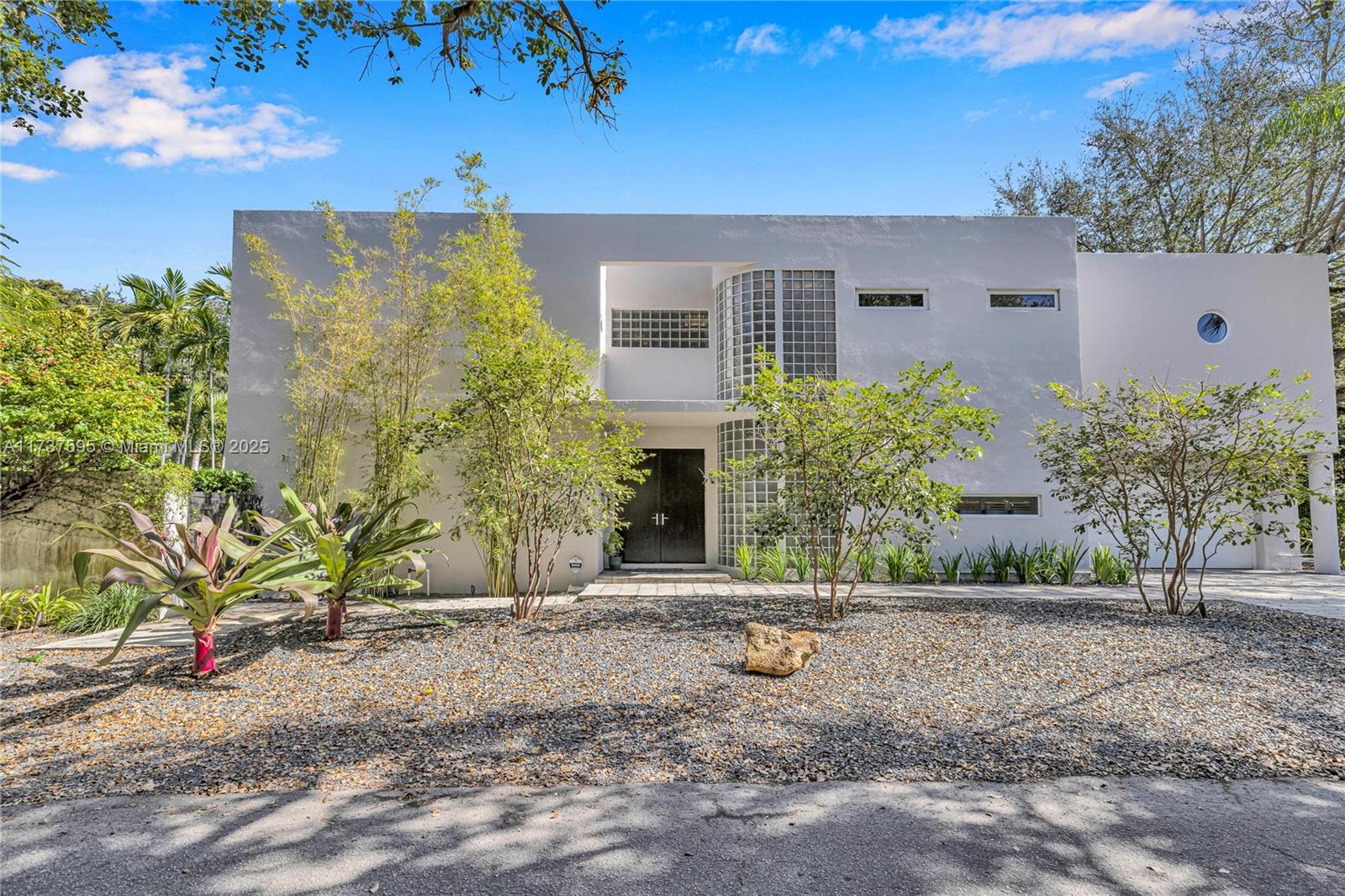 3701 Solana Road Miami, FL 33133 - Photo 2 of 38 front view of a house with a yard