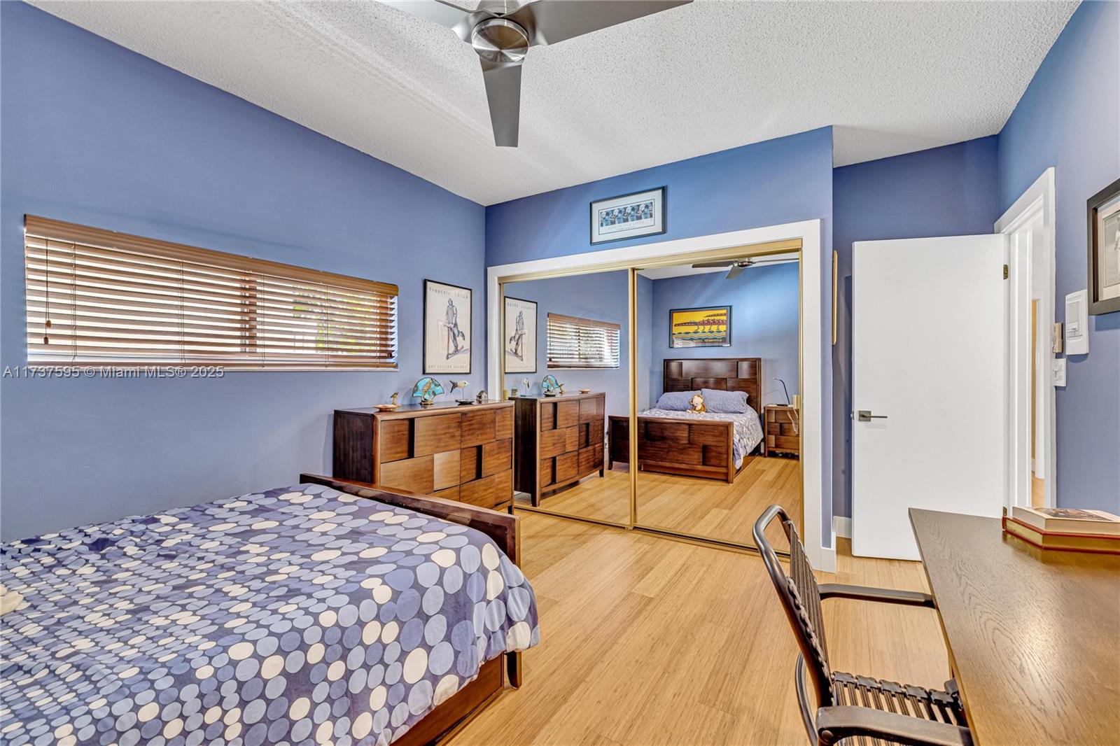 3701 Solana Road Miami, FL 33133 - Photo 30 of 38 a bedroom with a bed and wooden floor