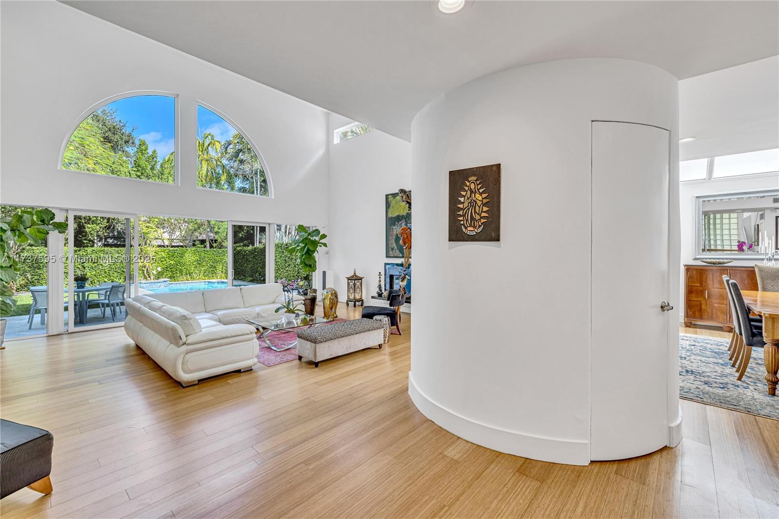 3701 Solana Road Miami, FL 33133 - Photo 3 of 38 a living room with furniture and a large window