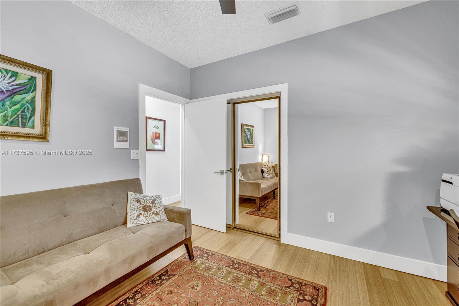 3701 Solana Road Miami, FL 33133 - Photo 32 of 38 a living room with furniture and a gate