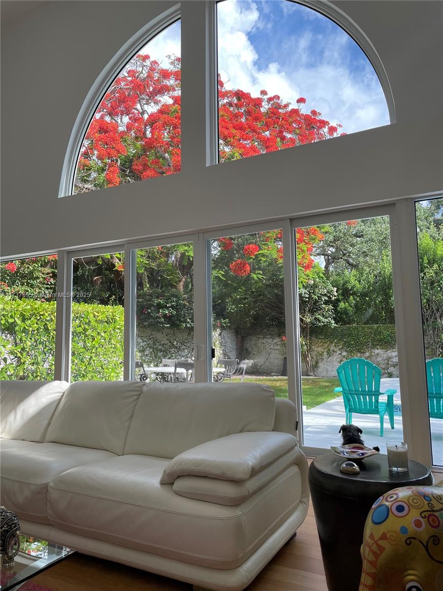 3701 Solana Road Miami, FL 33133 - Photo 6 of 38 a living room with furniture and a floor to ceiling window