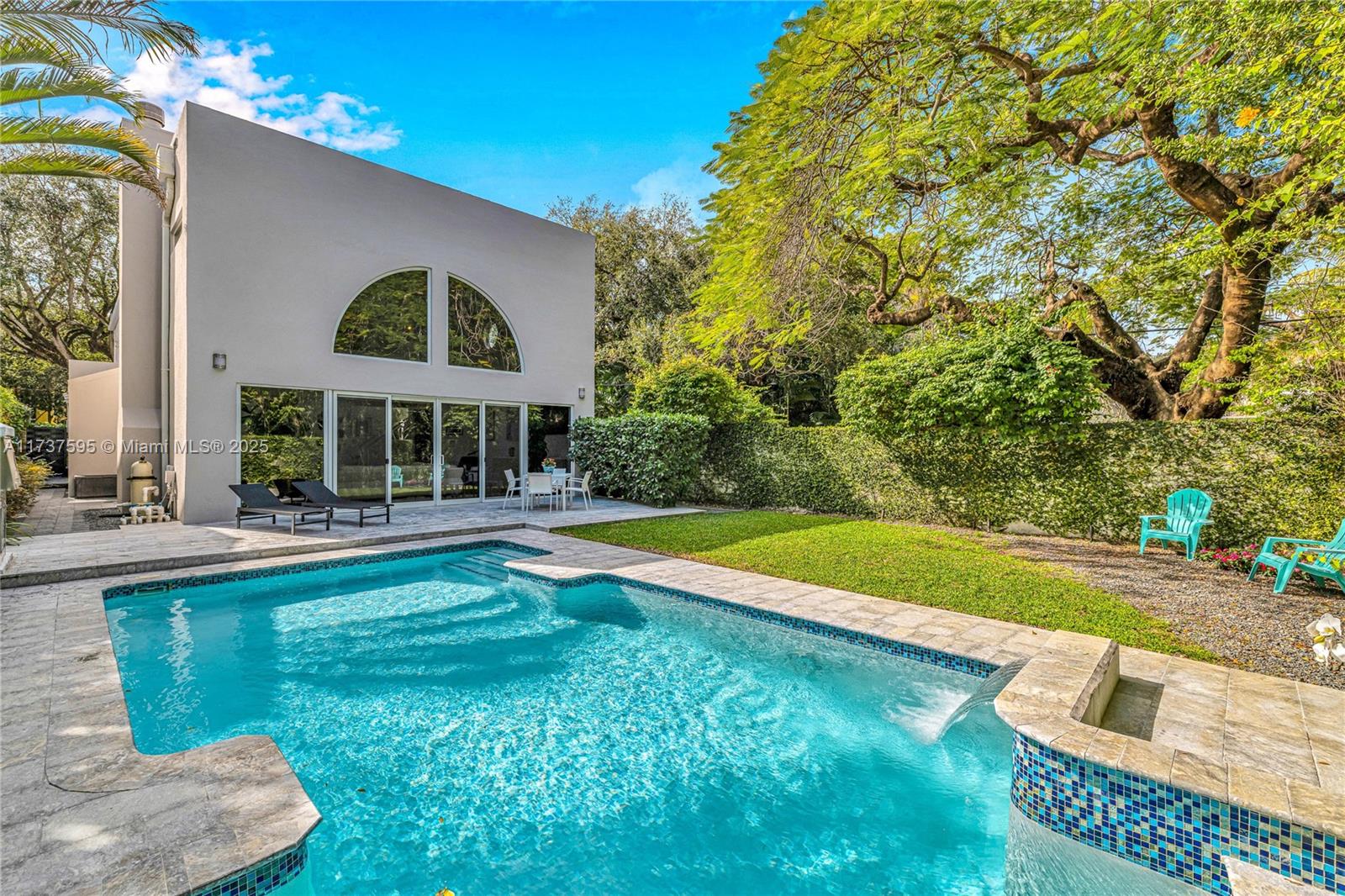 3701 Solana Road Miami, FL 33133 - Photo 9 of 38 a view of a house with swimming pool and a yard