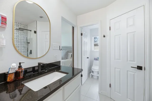 a view of a patio with chairs and a yard