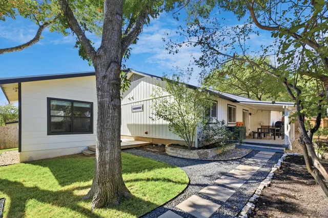 a view of backyard with a small cabin